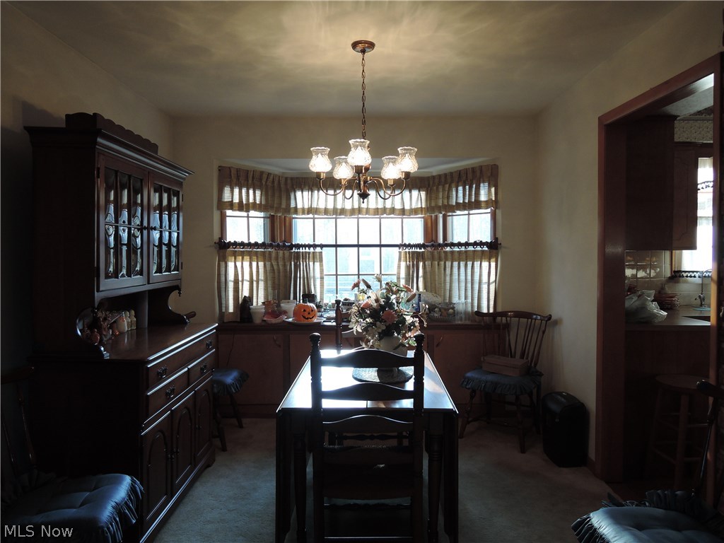11960 Summers Road Chesterland, OH 44026 - Photo 3 of 17 Formal dining room with a bay window looking out to the back yard.