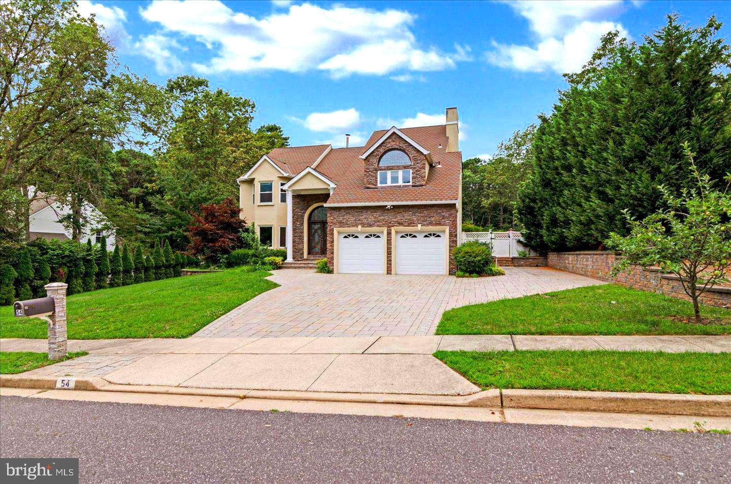 54 Las Brisas Boulevard Voorhees, NJ 08043 - Photo 1 of 67 a front view of a house with a yard and garage