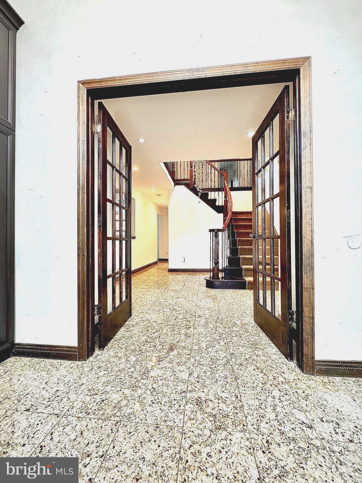 54 Las Brisas Boulevard Voorhees, NJ 08043 - Photo 13 of 67 a view of a hallway with wooden walls and floor to ceiling window