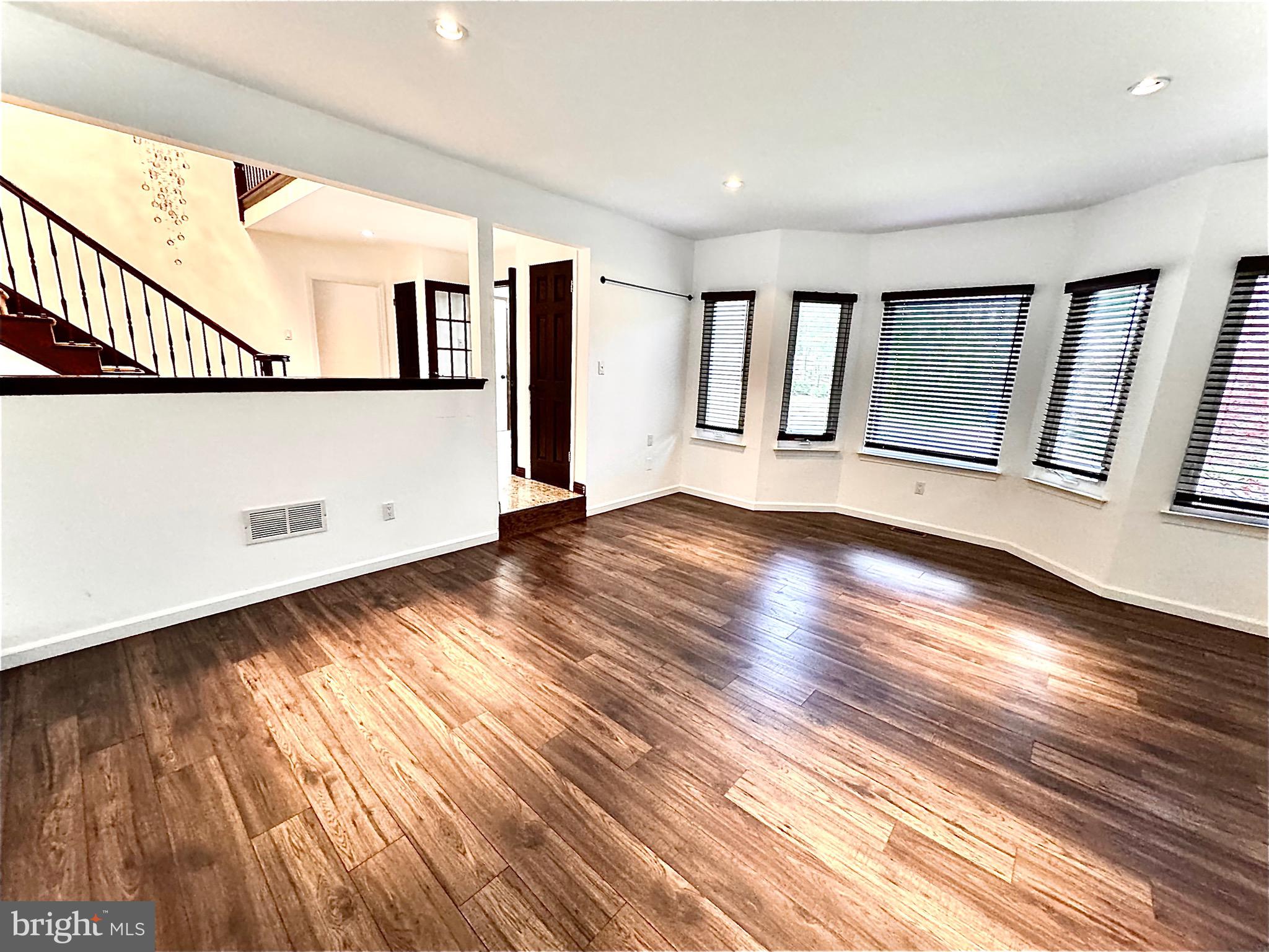 54 Las Brisas Boulevard Voorhees, NJ 08043 - Photo 17 of 67 a view of an empty room with wooden floor and a window