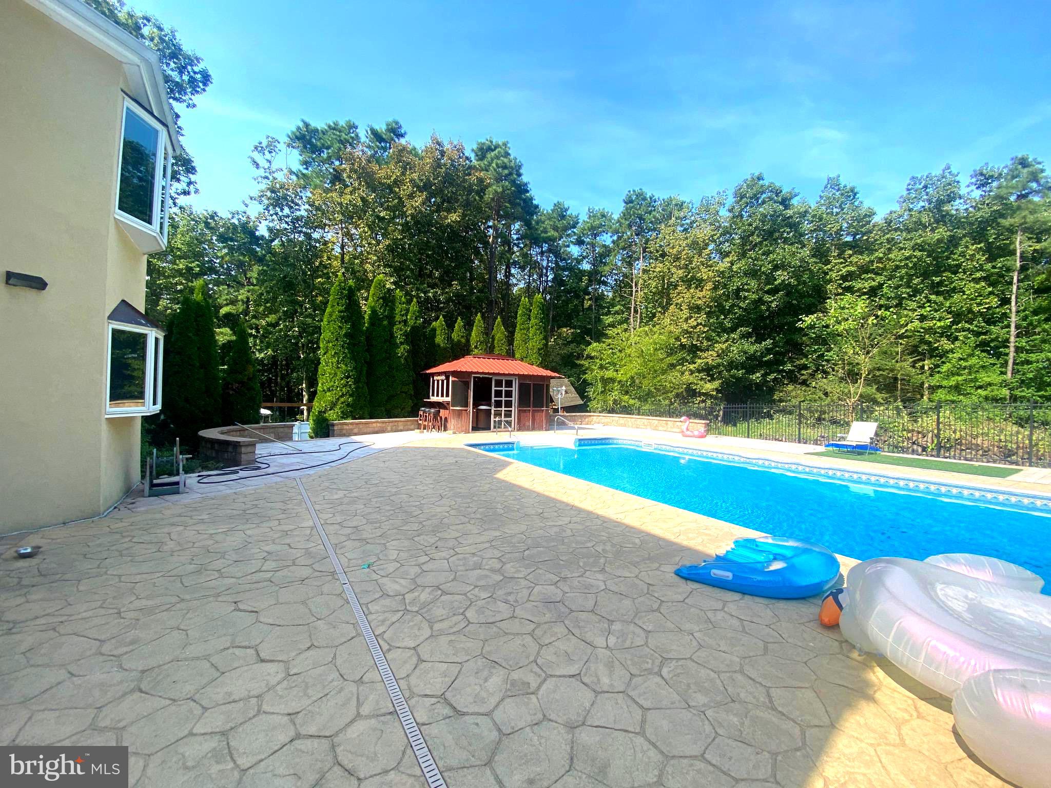54 Las Brisas Boulevard Voorhees, NJ 08043 - Photo 2 of 67 a view of a swimming pool with an outdoor seating and a yard