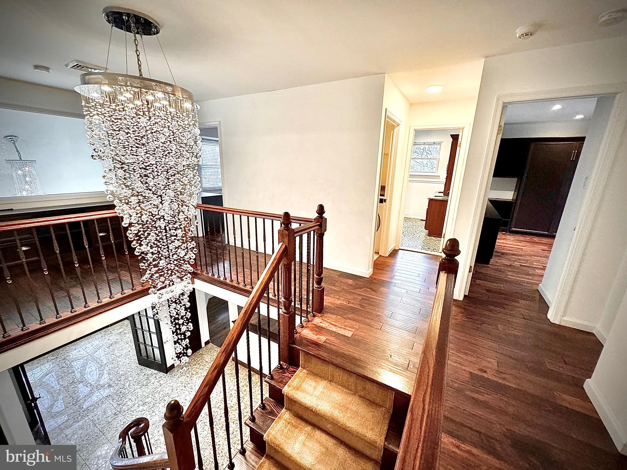 54 Las Brisas Boulevard Voorhees, NJ 08043 - Photo 35 of 67 a view of a dining room with furniture wooden floor and chandelier