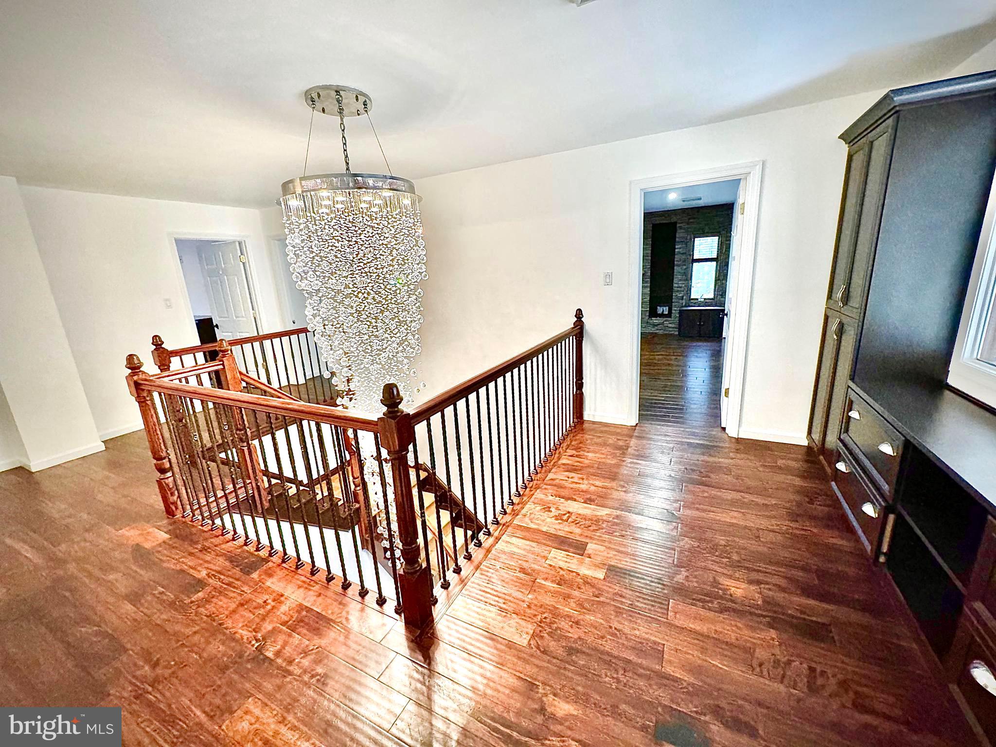 54 Las Brisas Boulevard Voorhees, NJ 08043 - Photo 36 of 67 a view of a hallway with wooden floor and stairs