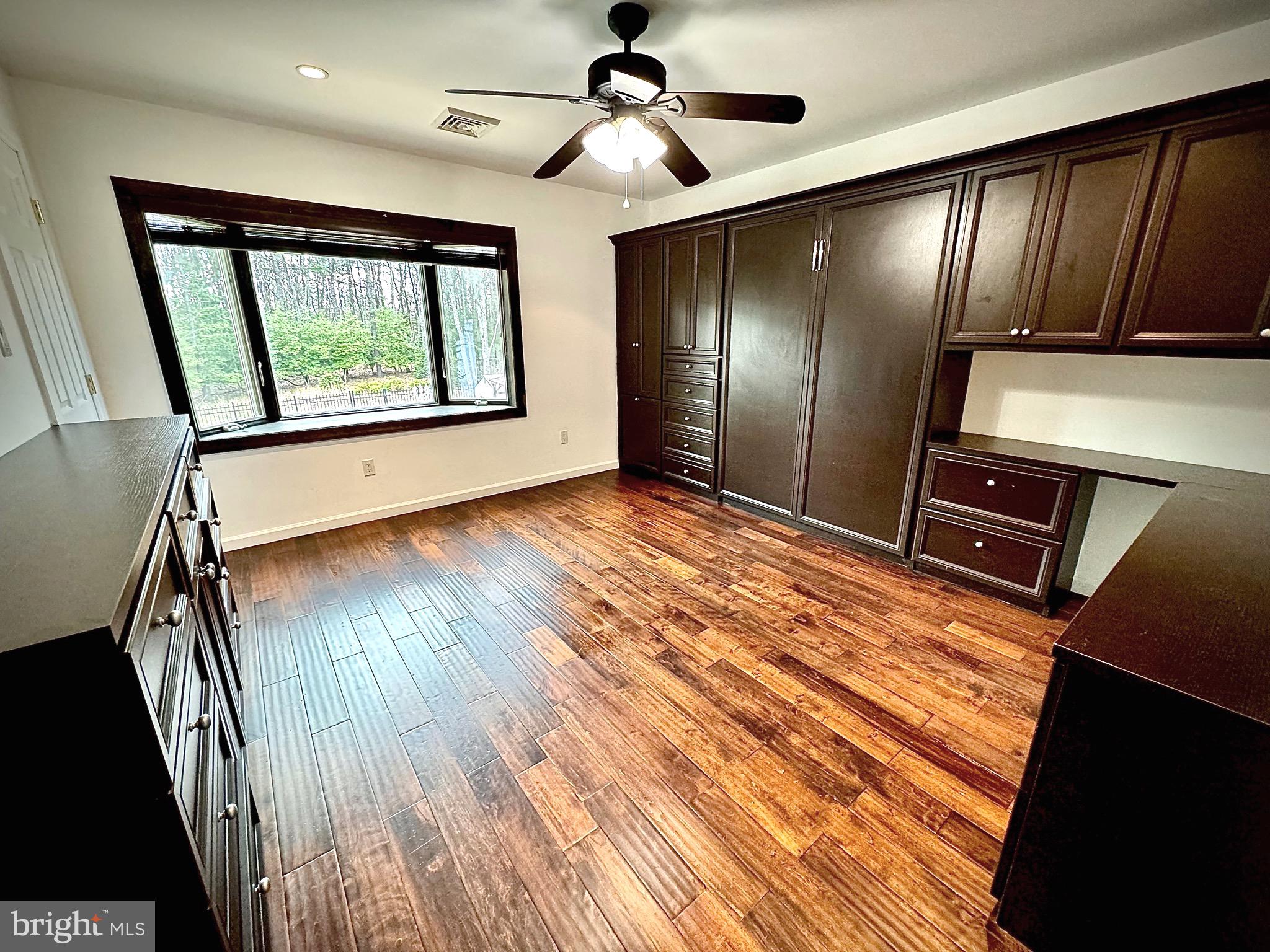54 Las Brisas Boulevard Voorhees, NJ 08043 - Photo 42 of 67 a view of an empty room with wooden floor and windows