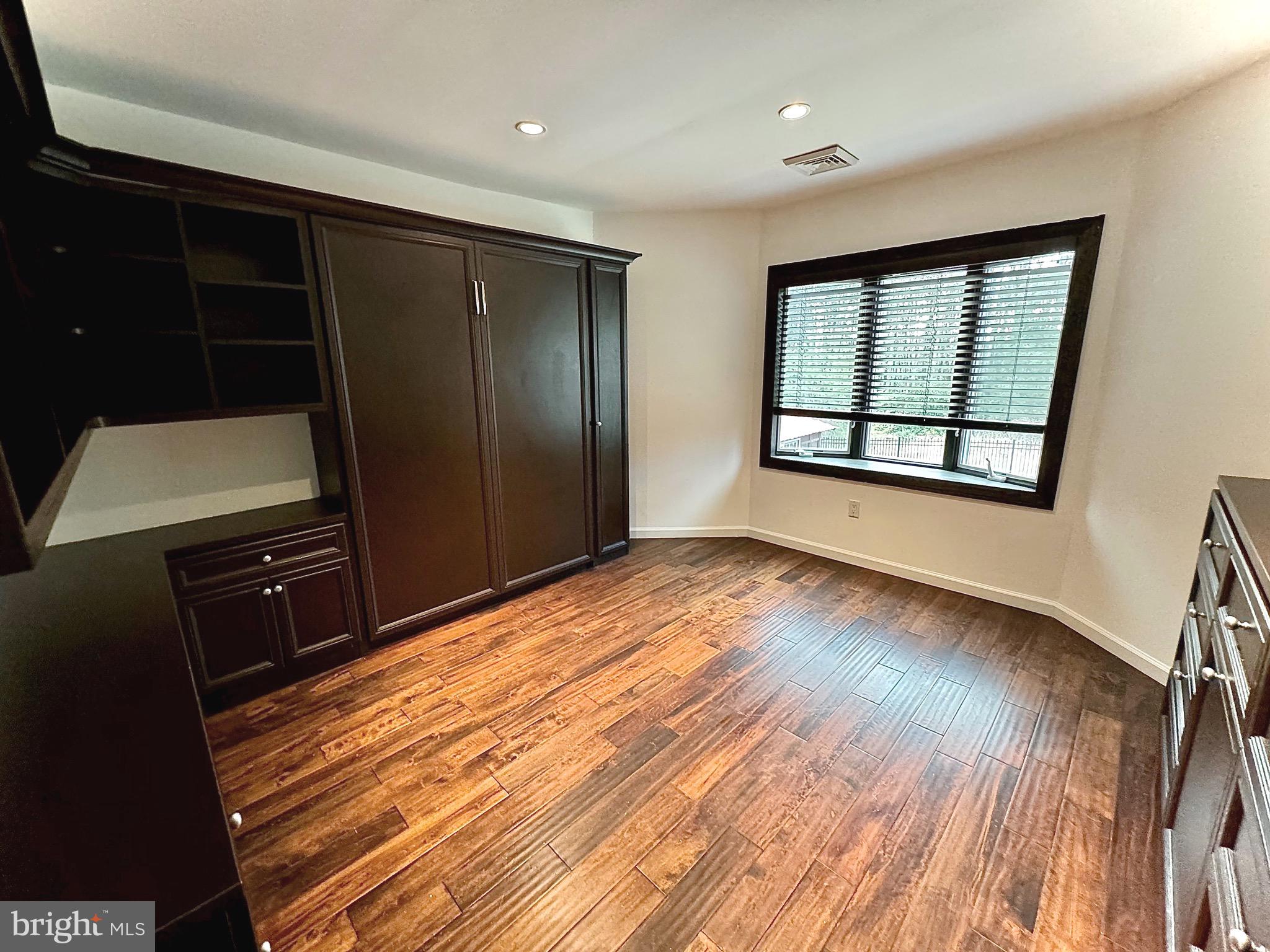 54 Las Brisas Boulevard Voorhees, NJ 08043 - Photo 44 of 67 wooden floor in an empty room with a window