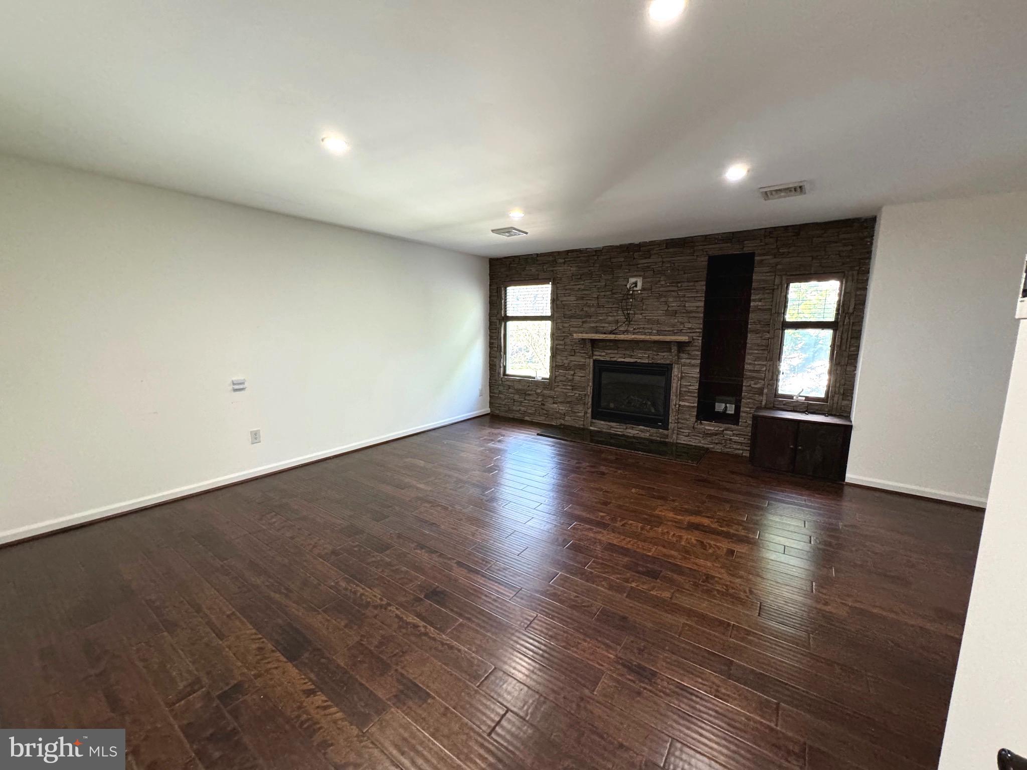54 Las Brisas Boulevard Voorhees, NJ 08043 - Photo 49 of 67 an empty room with wooden floor and fireplace