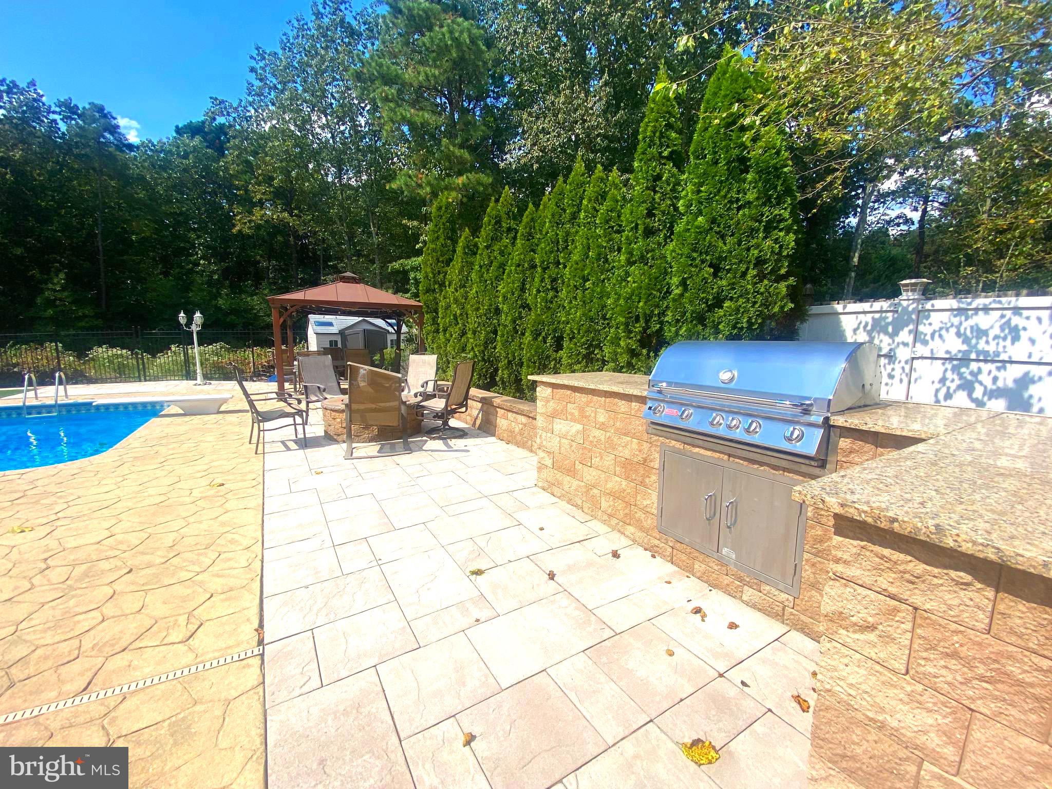 54 Las Brisas Boulevard Voorhees, NJ 08043 - Photo 7 of 67 a view of a backyard with sitting area