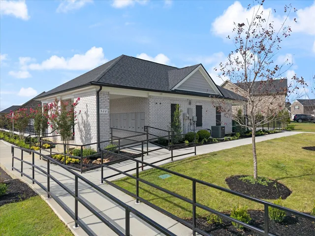 a view of a house with backyard and porch