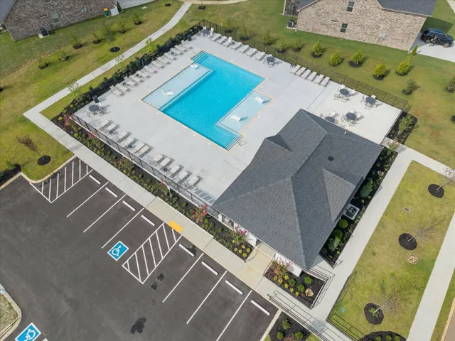 an aerial view of a pool table and chairs