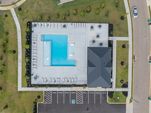 an aerial view of a house with pool