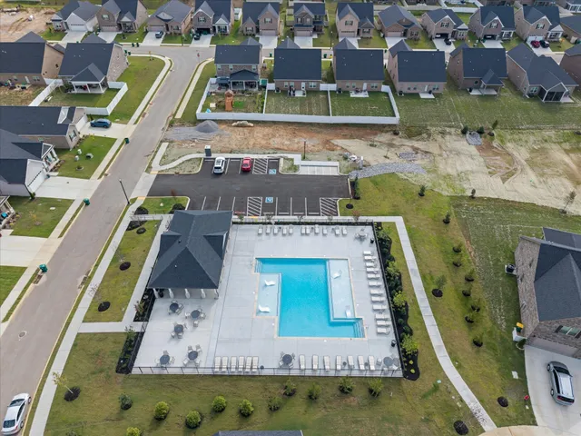 an aerial view of a house with a swimming pool