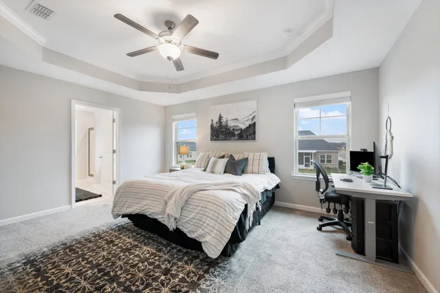 a bed room with a bed and a chandelier