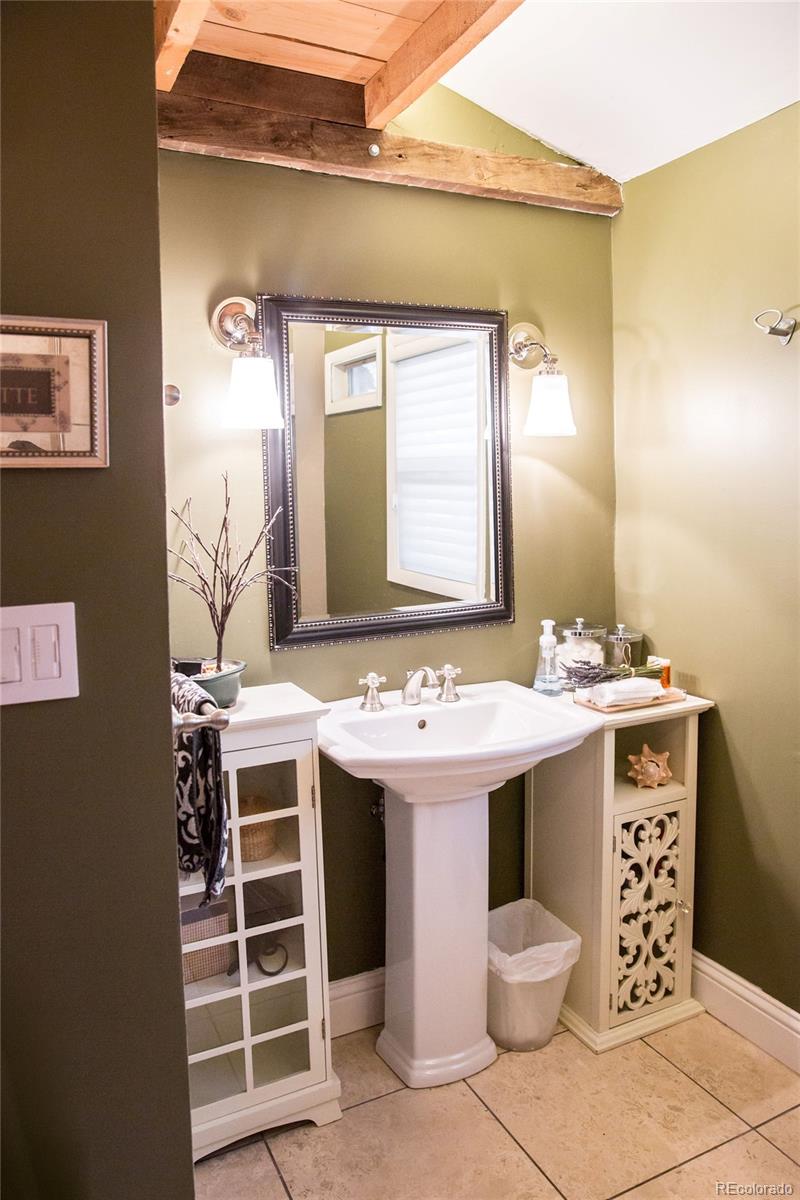 983 Cherryvale Road Boulder, CO 80303 - Photo 20 of 36 a bathroom with a sink and a mirror