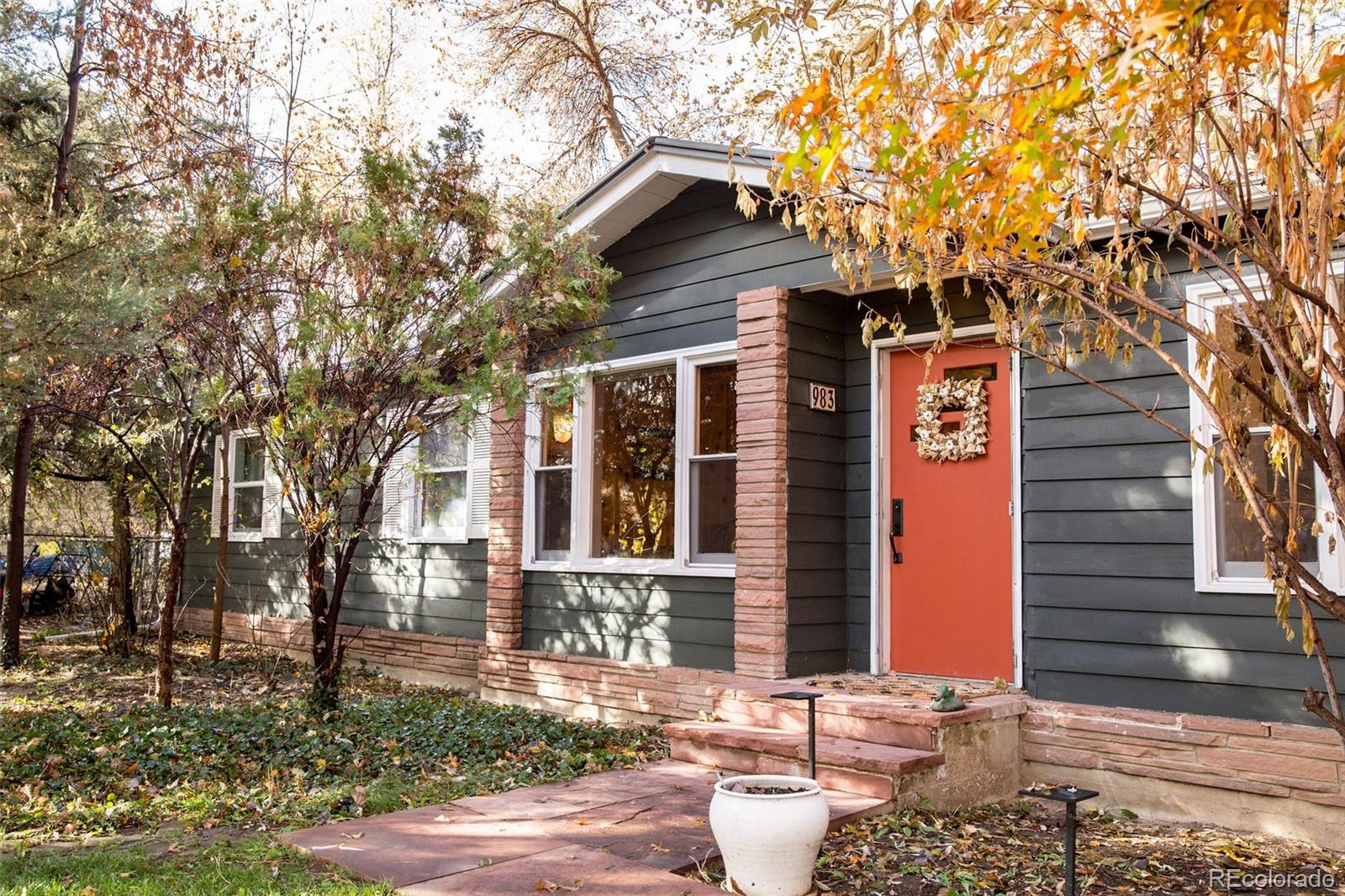 983 Cherryvale Road Boulder, CO 80303 - Photo 2 of 36 a front view of a house with a yard