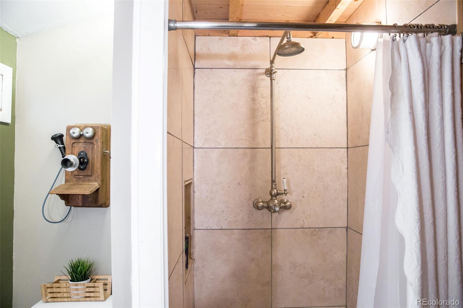 983 Cherryvale Road Boulder, CO 80303 - Photo 21 of 36 a bathroom with a bath tub and shower