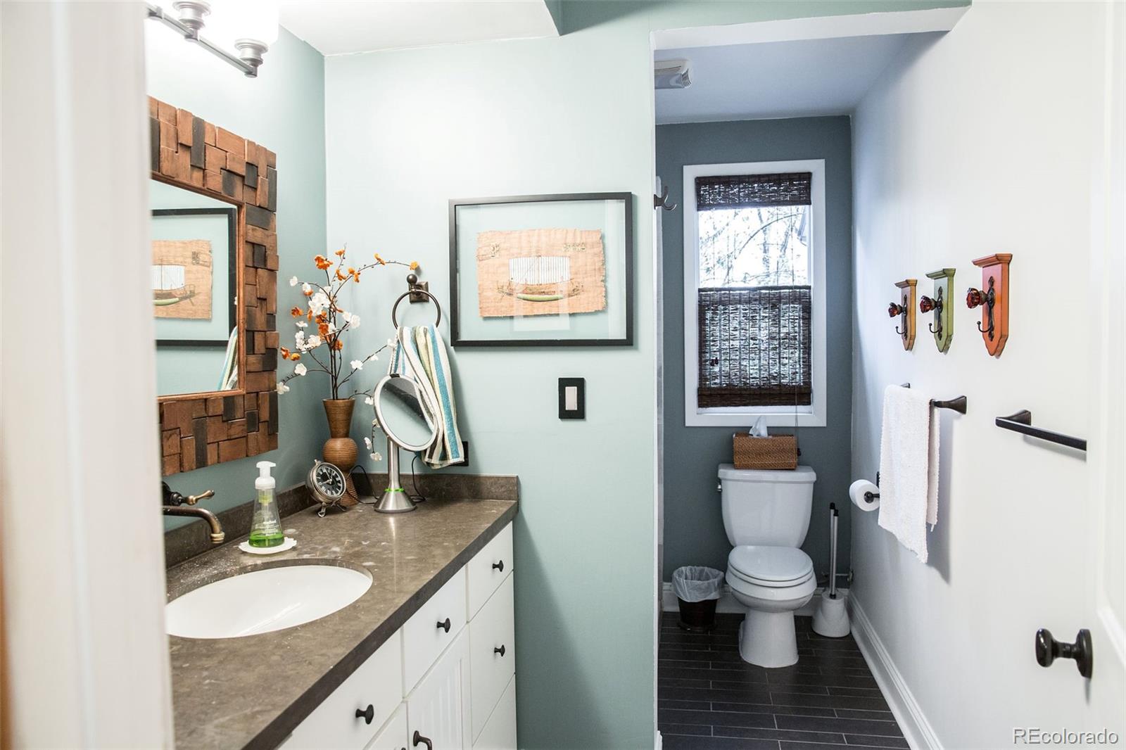 983 Cherryvale Road Boulder, CO 80303 - Photo 7 of 36 a bathroom with a toilet sink and mirror
