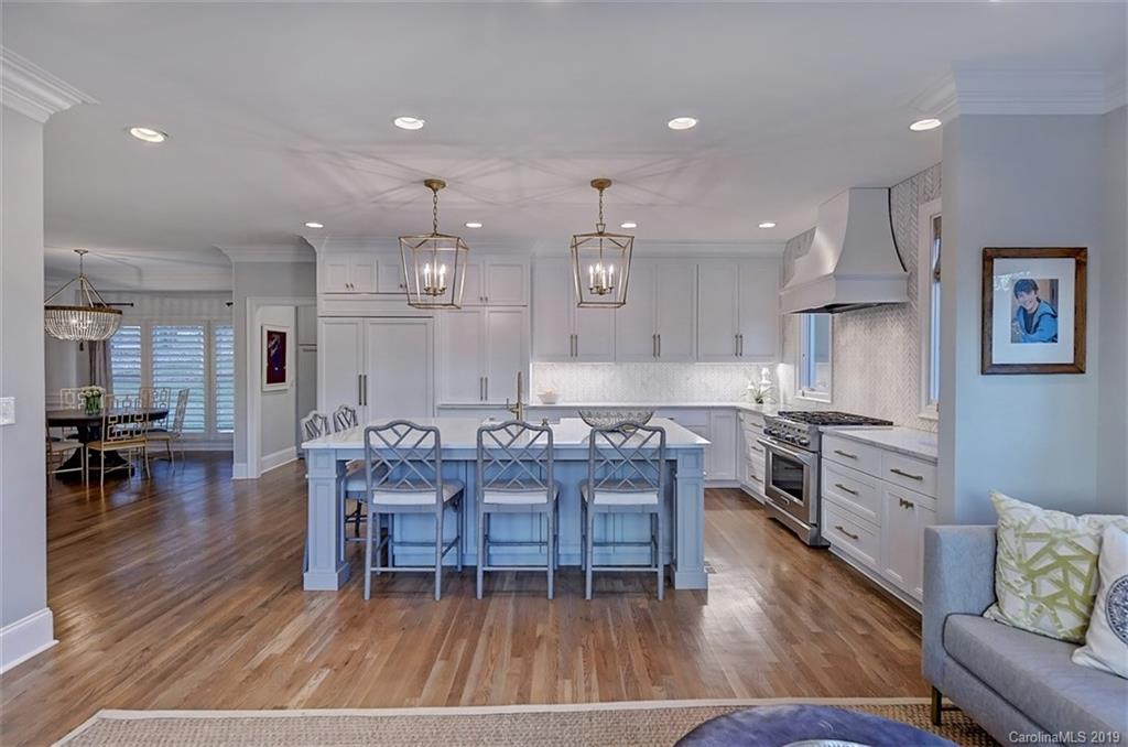 188 Chatham Road Mooresville, NC 28117 - Photo 13 of 48 an open kitchen with cabinets wooden floor and stainless steel appliances