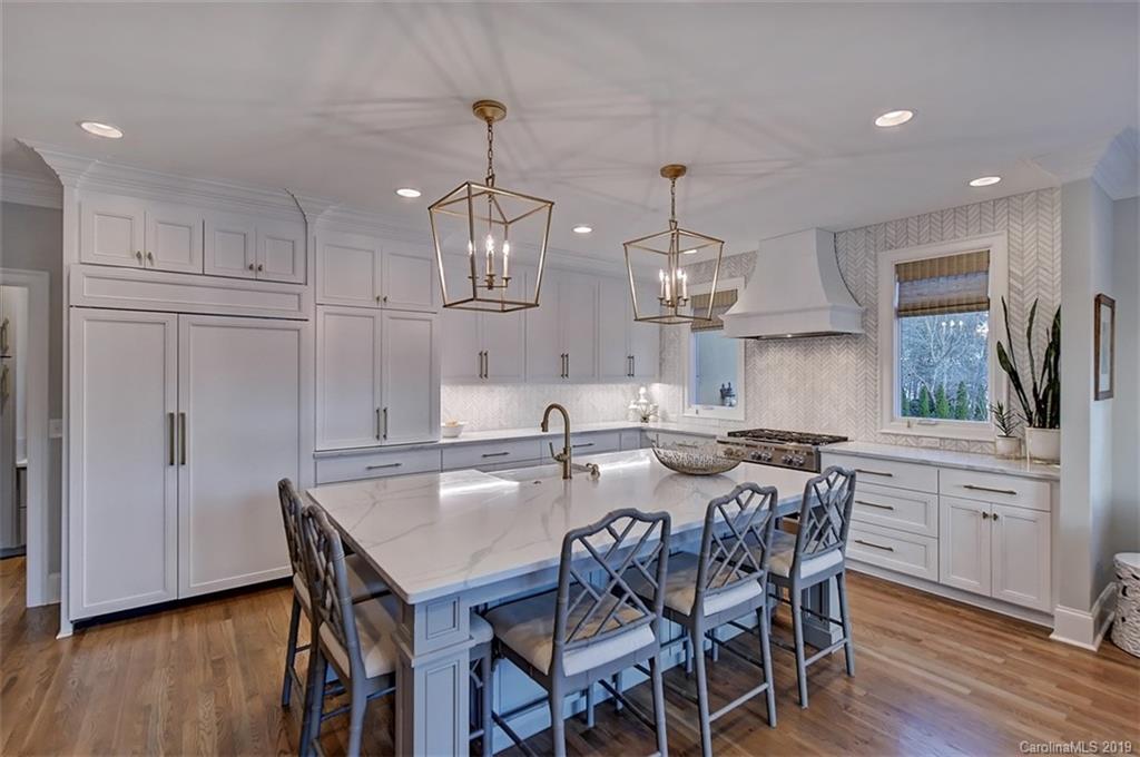 188 Chatham Road Mooresville, NC 28117 - Photo 14 of 48 a kitchen with stainless steel appliances granite countertop a kitchen island a stove a table and chairs