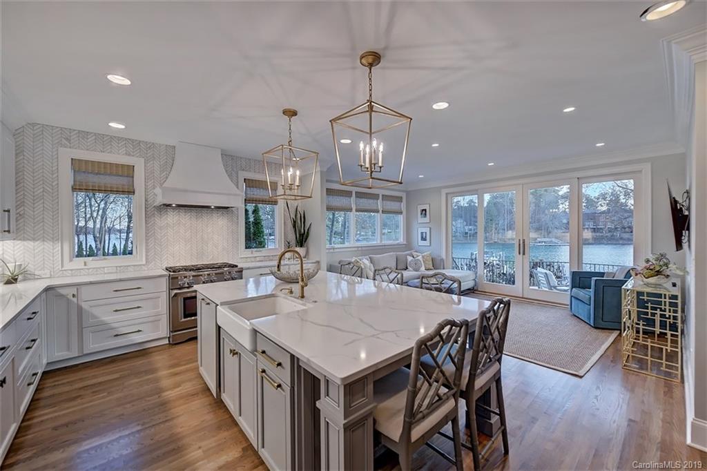188 Chatham Road Mooresville, NC 28117 - Photo 16 of 48 a kitchen with a stove center island wooden floor and a counter top space