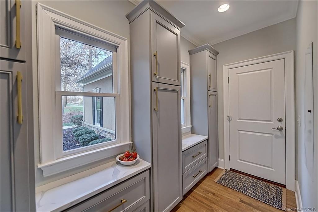188 Chatham Road Mooresville, NC 28117 - Photo 19 of 48 a kitchen with white cabinets and wooden floor
