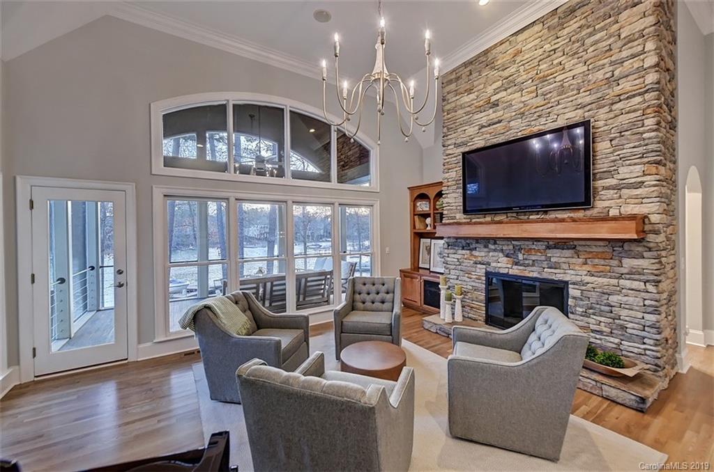 188 Chatham Road Mooresville, NC 28117 - Photo 20 of 48 a living room with furniture a fireplace and a flat screen tv