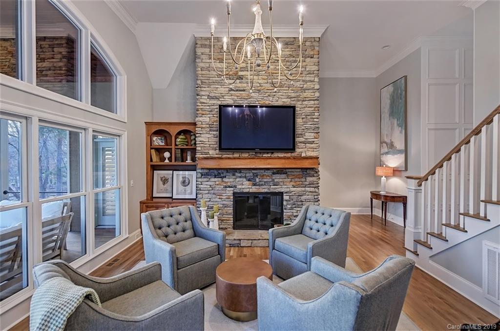 188 Chatham Road Mooresville, NC 28117 - Photo 21 of 48 a living room with furniture a fireplace and a chandelier