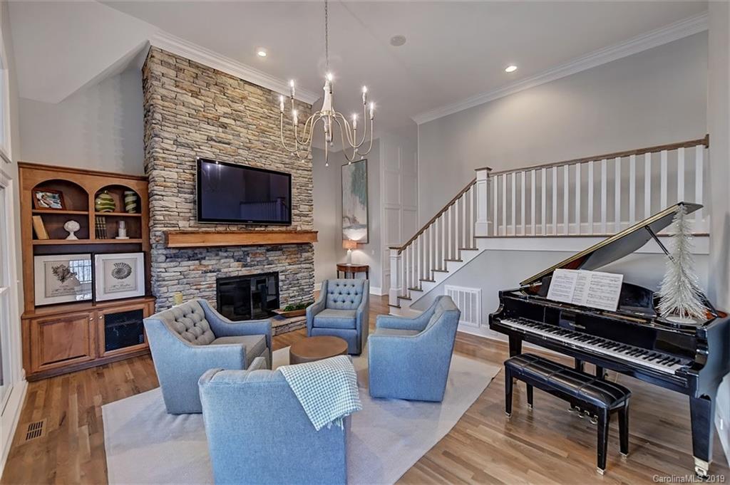188 Chatham Road Mooresville, NC 28117 - Photo 22 of 48 a living room with fireplace furniture and a flat screen tv