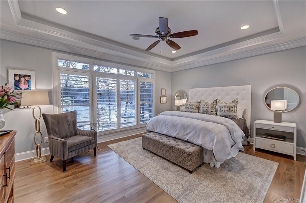 188 Chatham Road Mooresville, NC 28117 - Photo 25 of 48 a spacious bedroom with a bed a couch and a large window