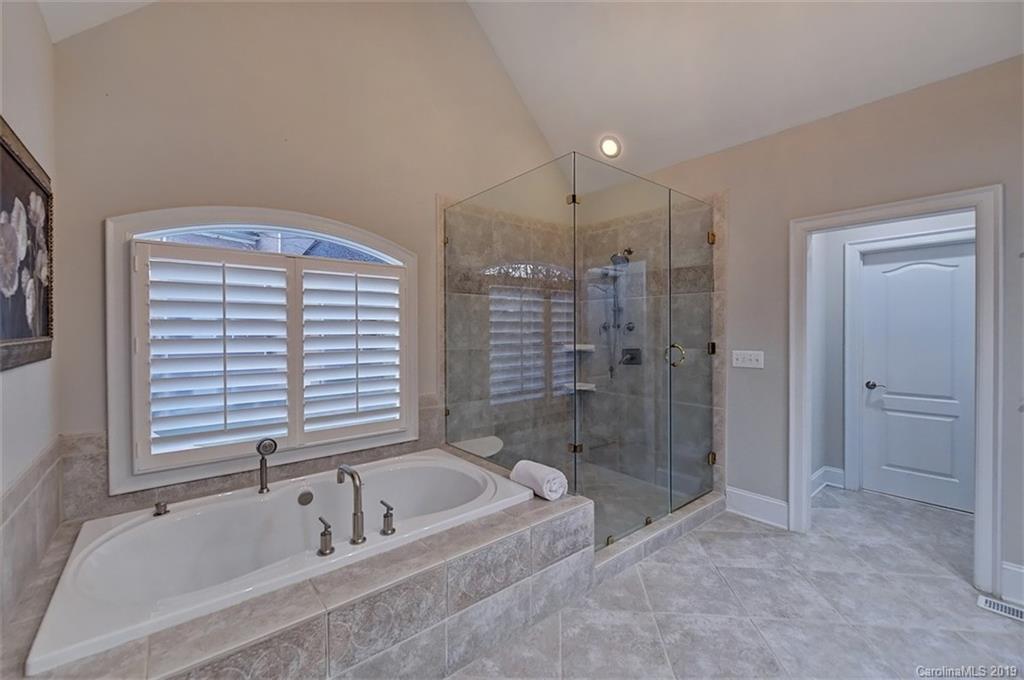 188 Chatham Road Mooresville, NC 28117 - Photo 28 of 48 a bathroom with a bathtub and a shower