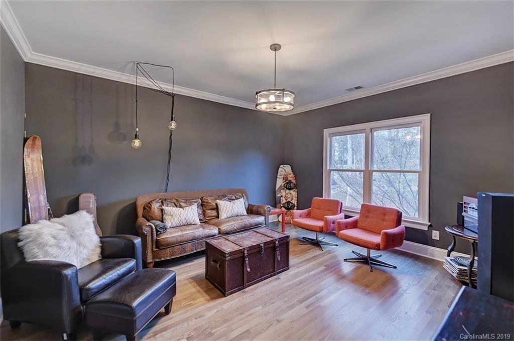 188 Chatham Road Mooresville, NC 28117 - Photo 29 of 48 a living room with furniture a chandelier and a window