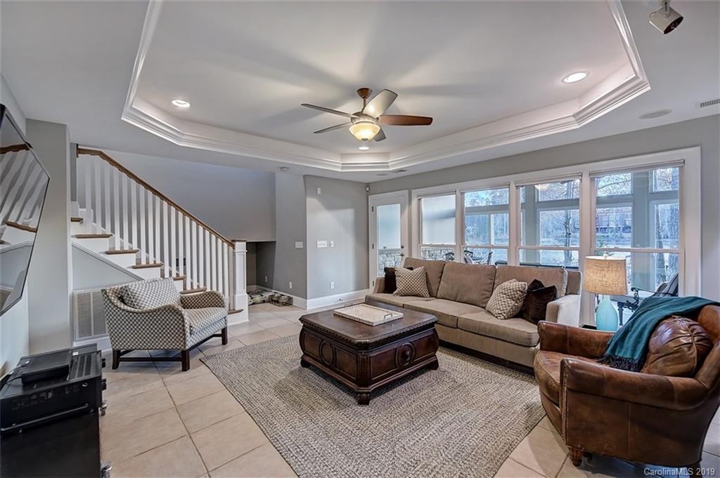 188 Chatham Road Mooresville, NC 28117 - Photo 35 of 48 a living room with furniture and a chandelier
