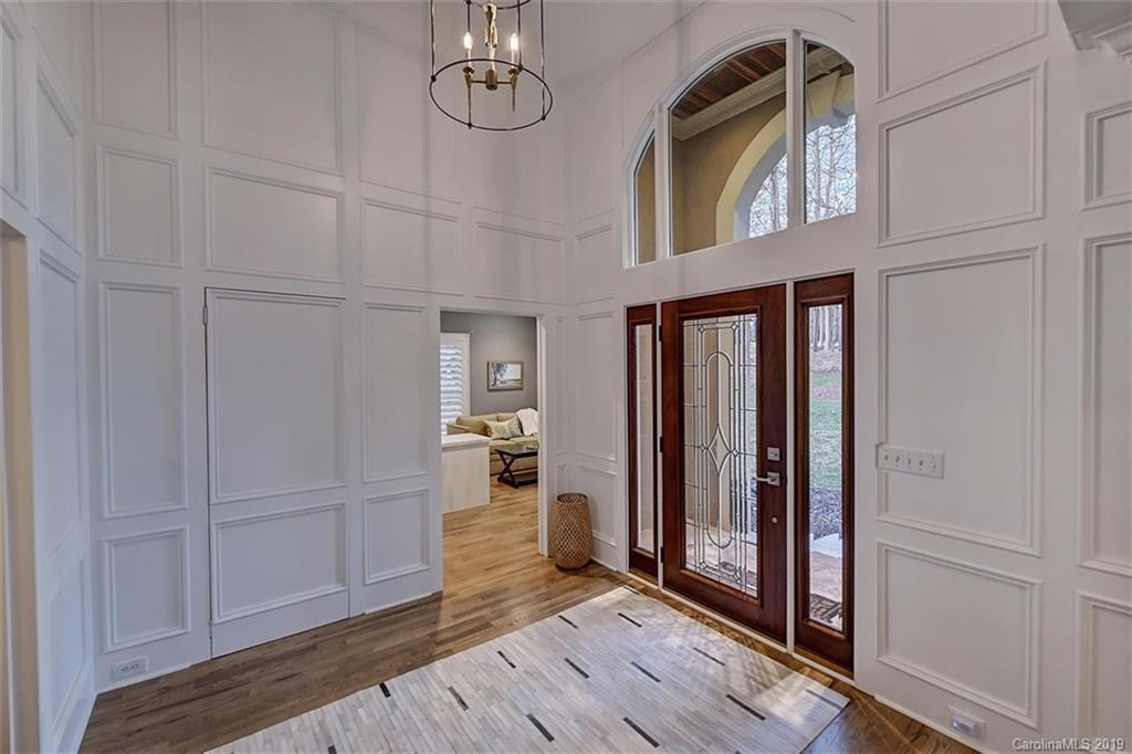 188 Chatham Road Mooresville, NC 28117 - Photo 5 of 48 a view of a hallway with wooden floor and staircase