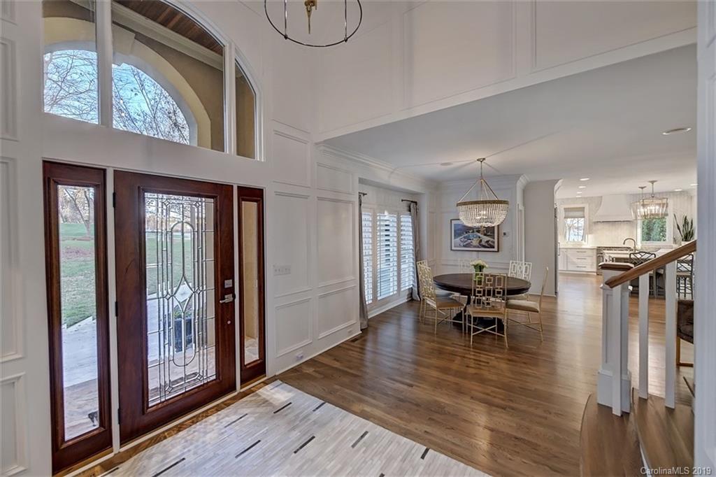188 Chatham Road Mooresville, NC 28117 - Photo 6 of 48 a view of a livingroom with furniture wooden floor a ceiling fan and windows