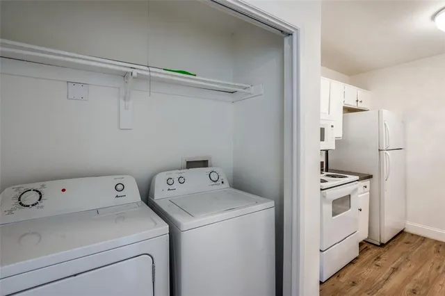a view of storage and utility room with washer and dryer
