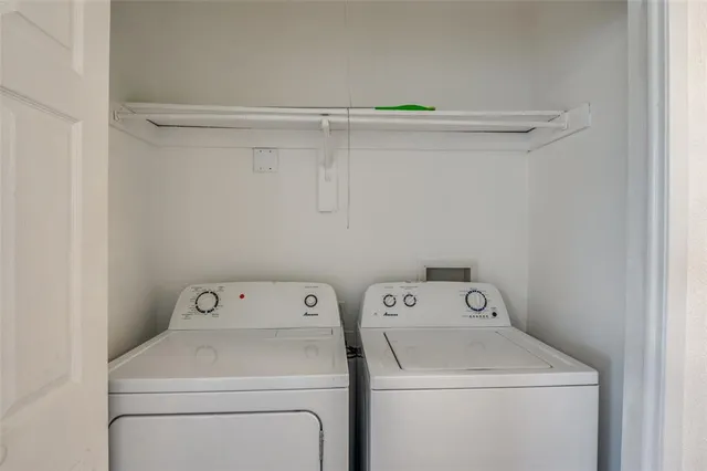 a view of storage room with washer and dryer
