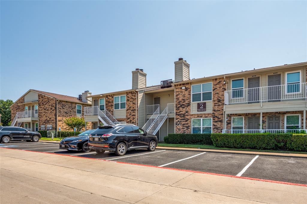 2200 East Trinity Mills Road, Unit 206 Carrollton, TX 75006 - Photo 3 of 24 a car parked on the side of the street