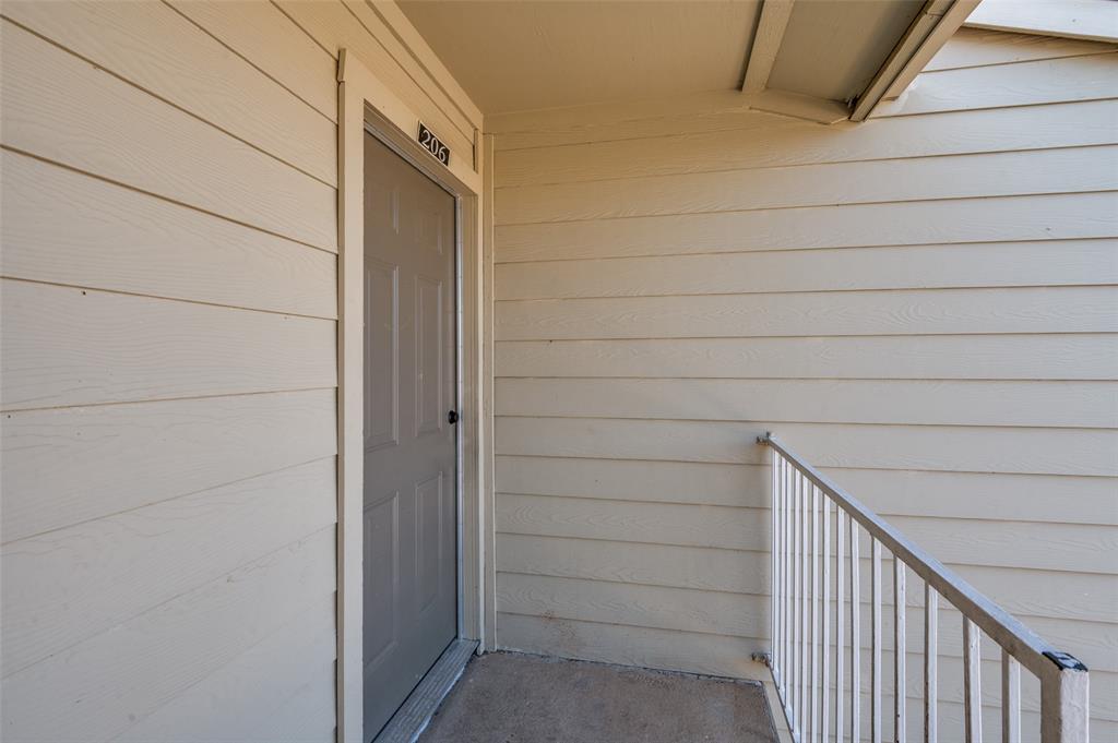 2200 East Trinity Mills Road, Unit 206 Carrollton, TX 75006 - Photo 4 of 24 a view of front door