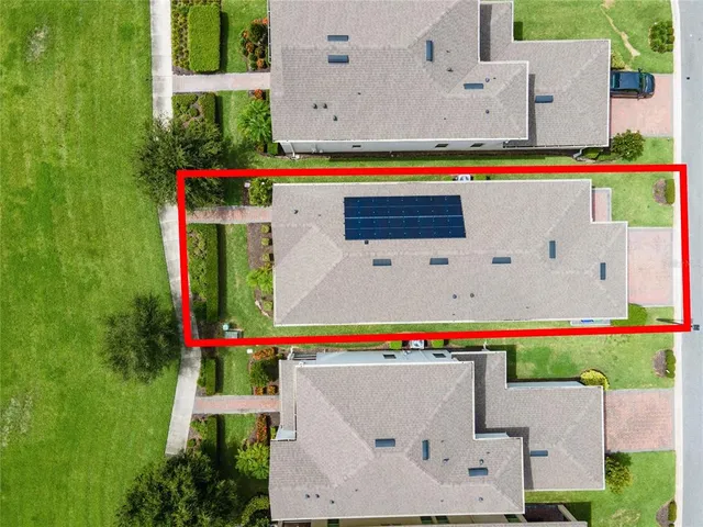 a view of a park with large trees