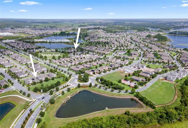 an aerial view of a house with a swimming pool