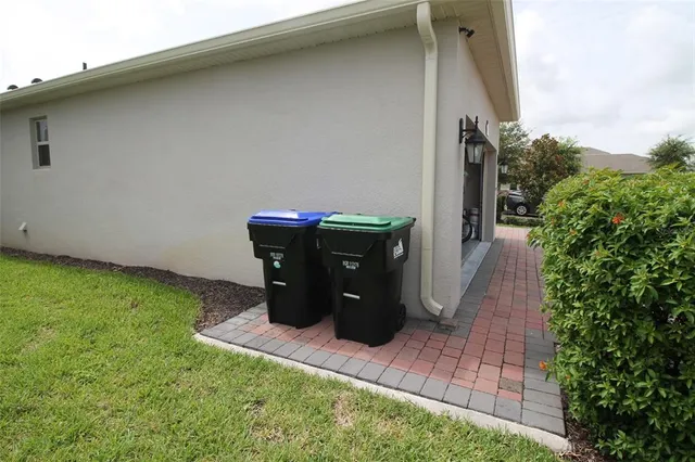 a living room with lots of furniture and a large window