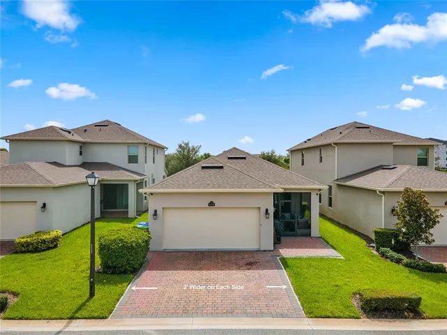 a living room filled with furniture and a flat screen tv