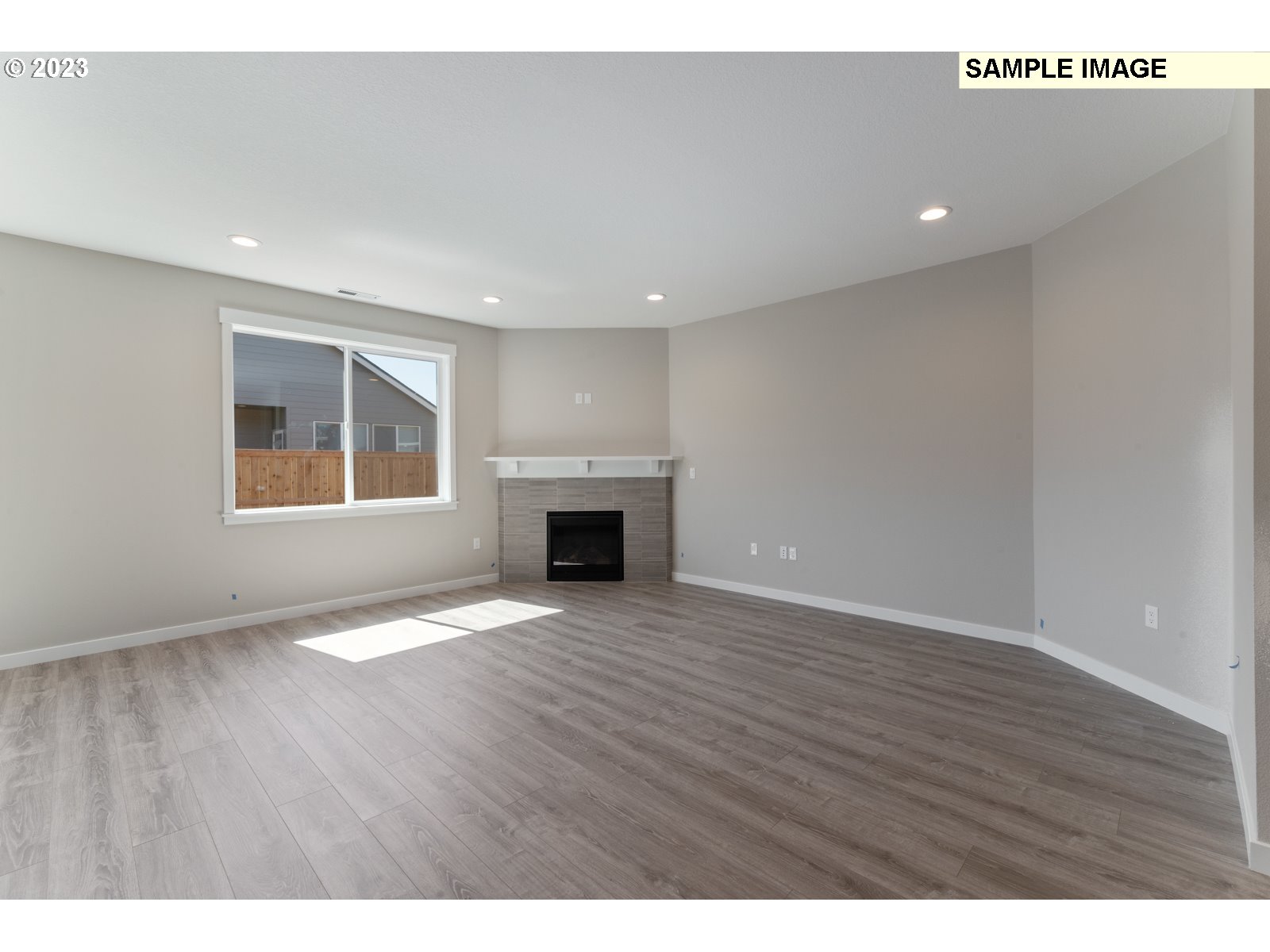 8853 North 5th Street, Unit 62 Ridgefield, WA 98642 - Photo 23 of 27 a view of an empty room with window and wooden floor