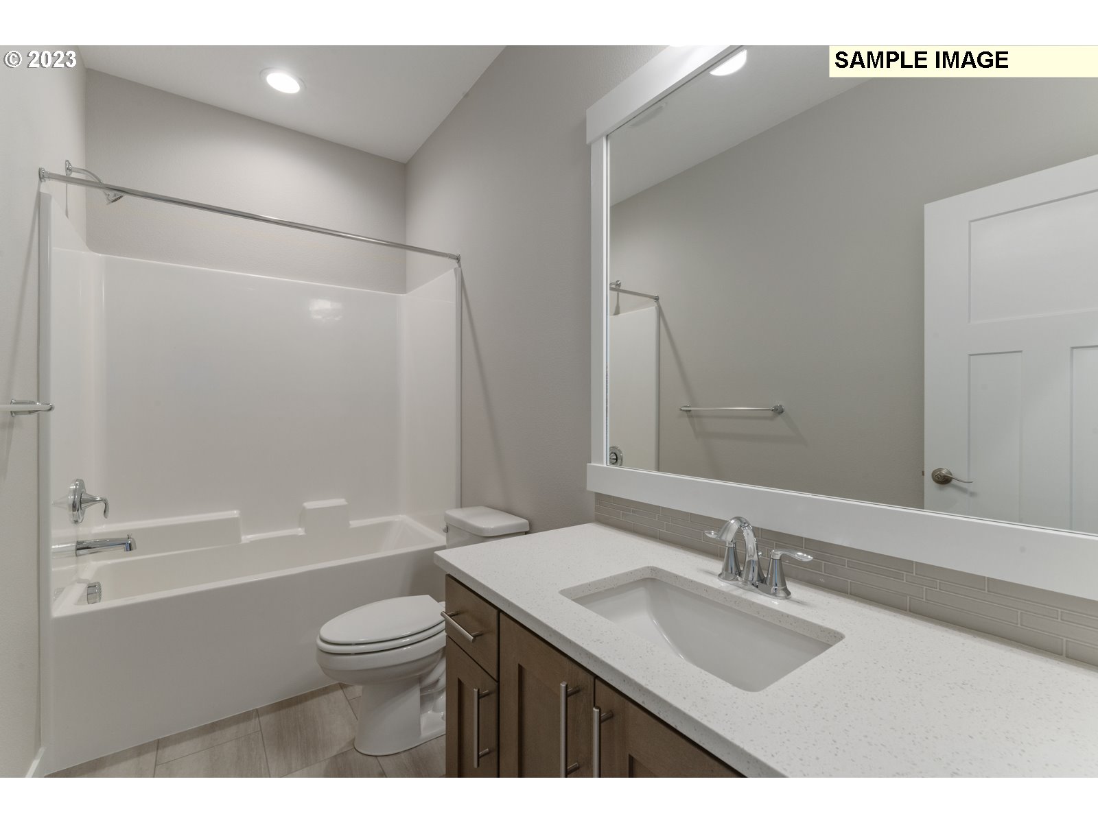 8853 North 5th Street, Unit 62 Ridgefield, WA 98642 - Photo 25 of 27 a bathroom with a granite countertop sink mirror toilet and bathtub