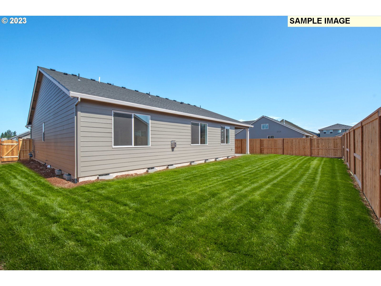 8853 North 5th Street, Unit 62 Ridgefield, WA 98642 - Photo 27 of 27 a view of a house with a backyard