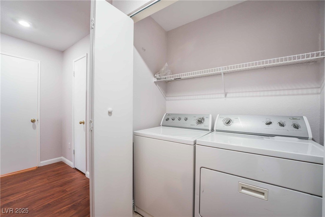 5415 West Harmon Avenue, Unit 1162 Las Vegas, NV 89103 - Photo 19 of 21 Laundry room with dark wood-type flooring and washer and dryer