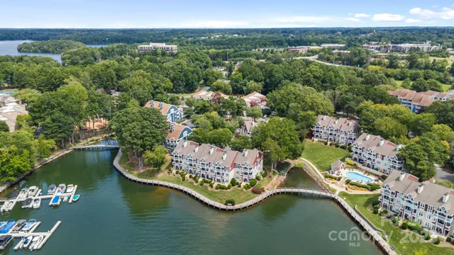 an aerial view of a house with a lake view