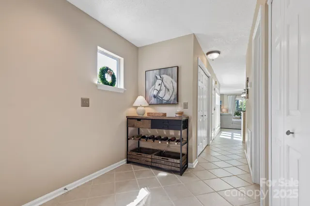 a room that has a dresser and a window in it