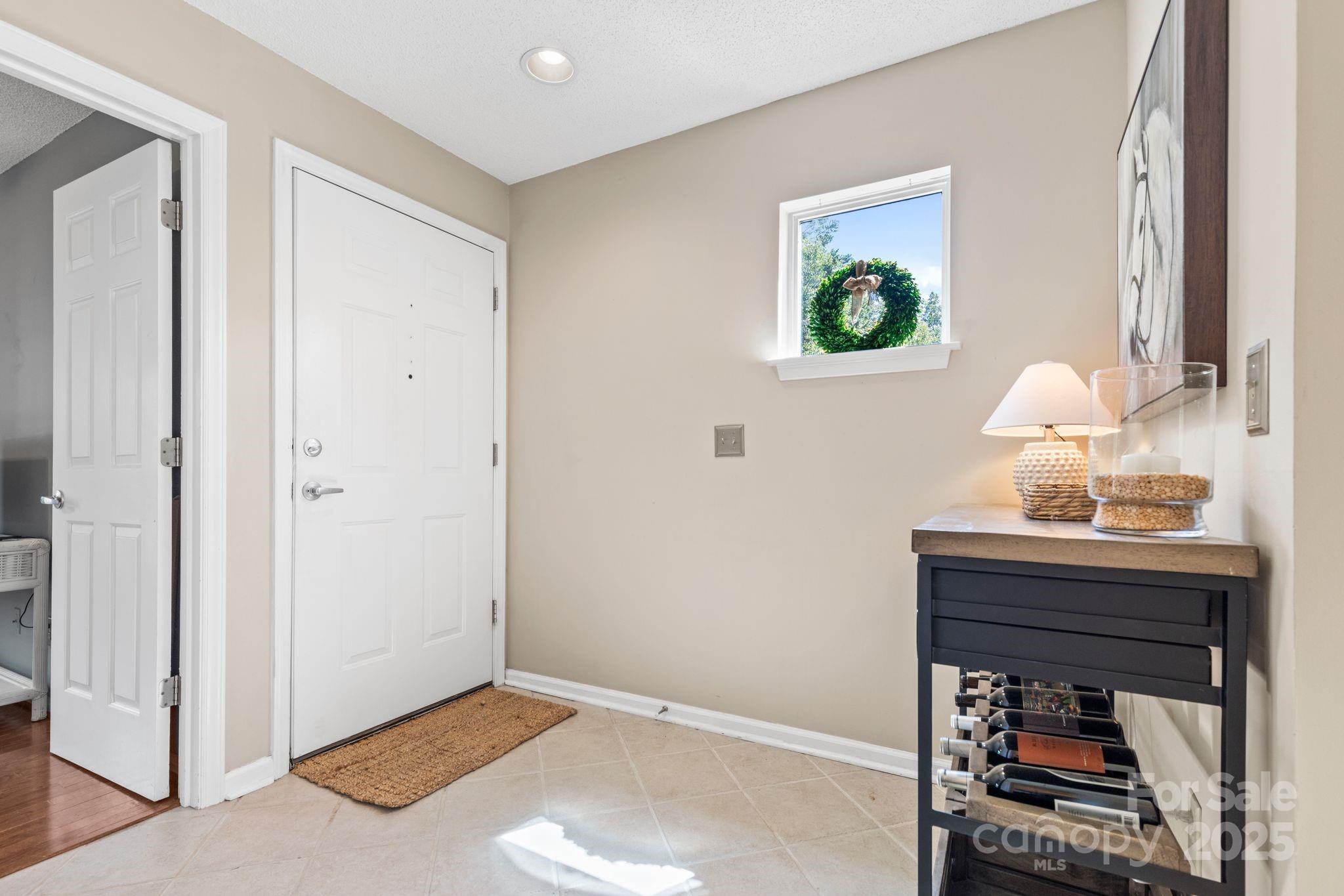 719 Southwest Drive Davidson, NC 28036 - Photo 15 of 27 a room that has a dresser and a window in it