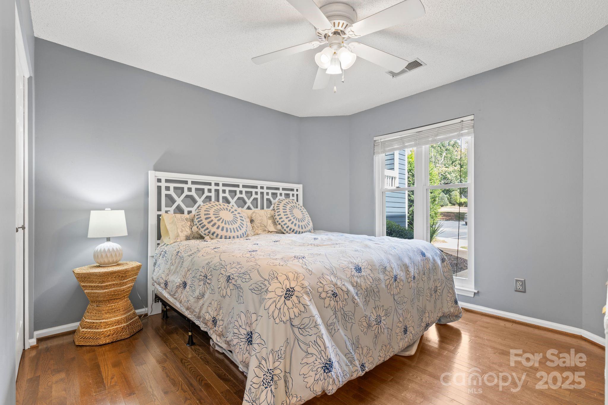 719 Southwest Drive Davidson, NC 28036 - Photo 16 of 27 a bedroom with a bed and a window