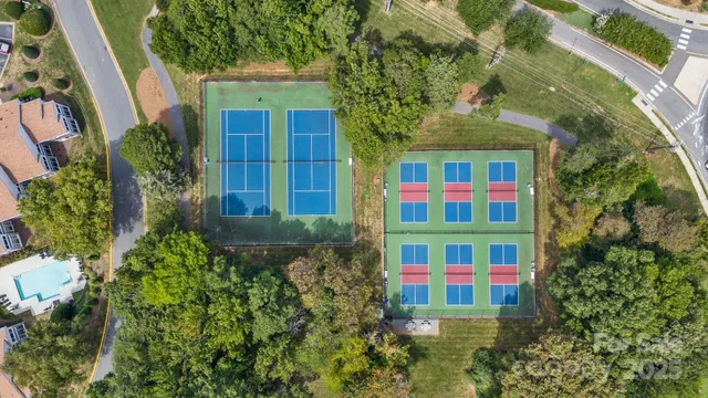 an aerial view of a houses with a lake view